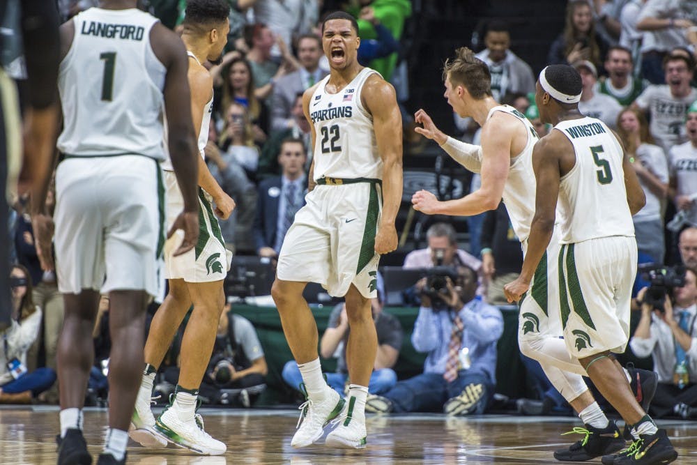 Sophomore guard Miles Bridges (22) expresses emotion after making the game winning shot during the second half of the men's basketball game against Purdue on Feb. 10, 2018 at Breslin Center. The Spartans defeated the Boilermakers, 68-65. (Nic Antaya | The State News)