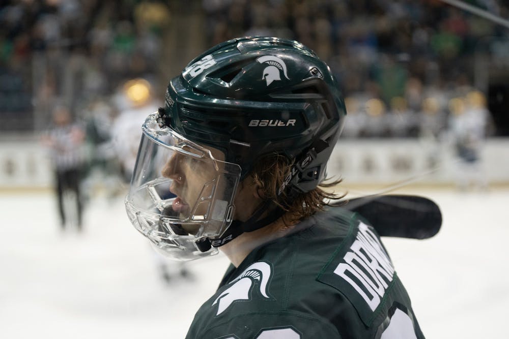 <p>MSU center Karsen Dorwart skates to the bench after a whistle at Compton Family Ice Arena in Notre Dame, IN on Friday, March 4, 2023. Dorwart recorded MSU’s fourth goal of the night in the beginning of the third period.</p>
