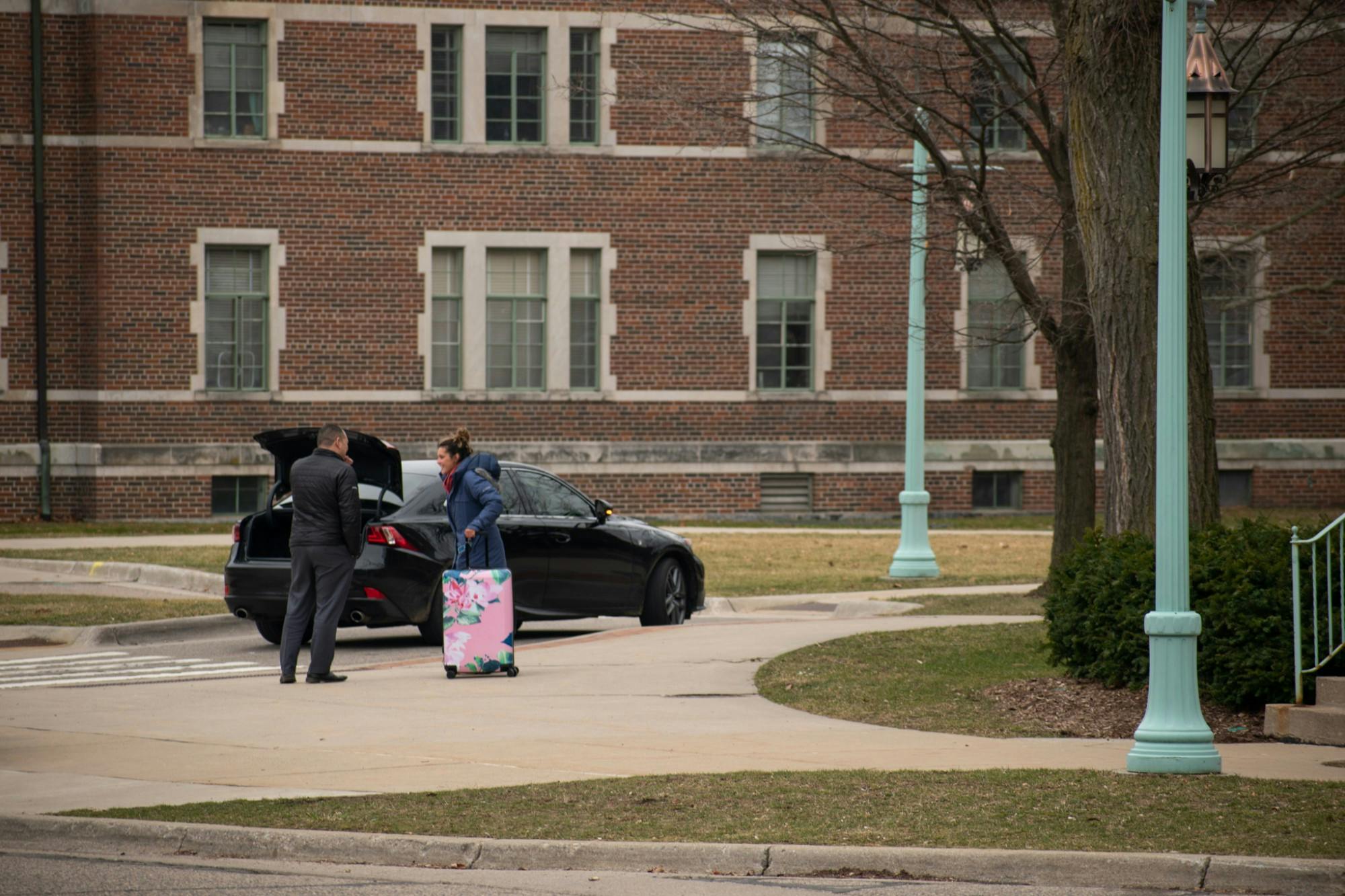 <p>An MSU student begins the process of leaving campus after MSU halted in-person classes due to the coronavirus March 11, 2020.</p>