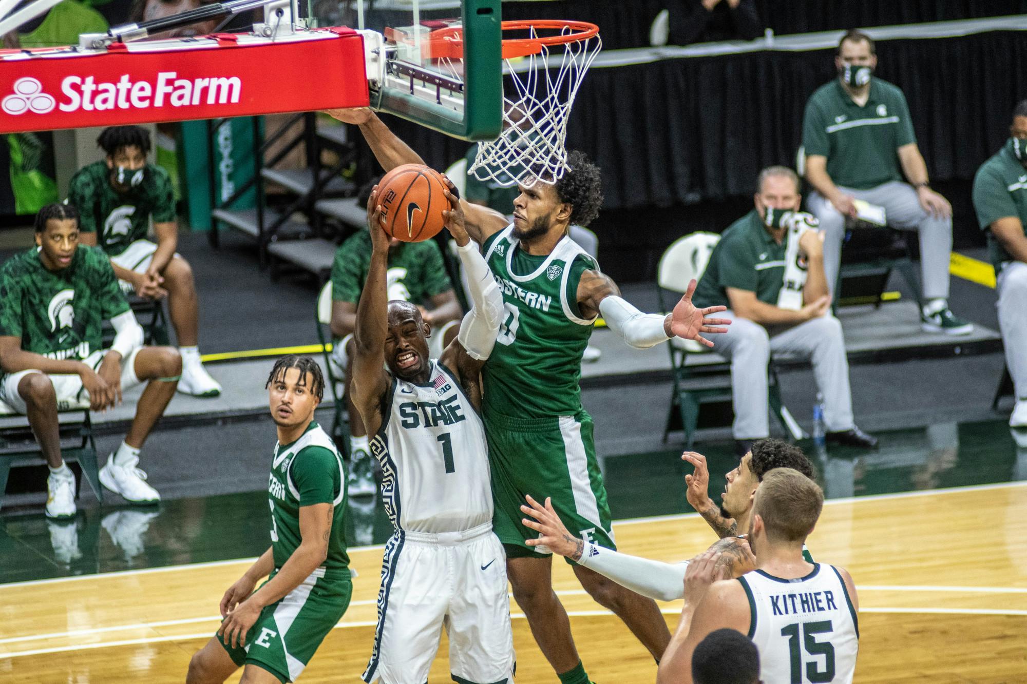 <p>Masters guard Joshua Langford (1) fights for the ball during the game against Eastern Michigan on Nov. 25, 2020 at the Breslin Center. The Spartans defeated the Eagles, 83-67.</p>