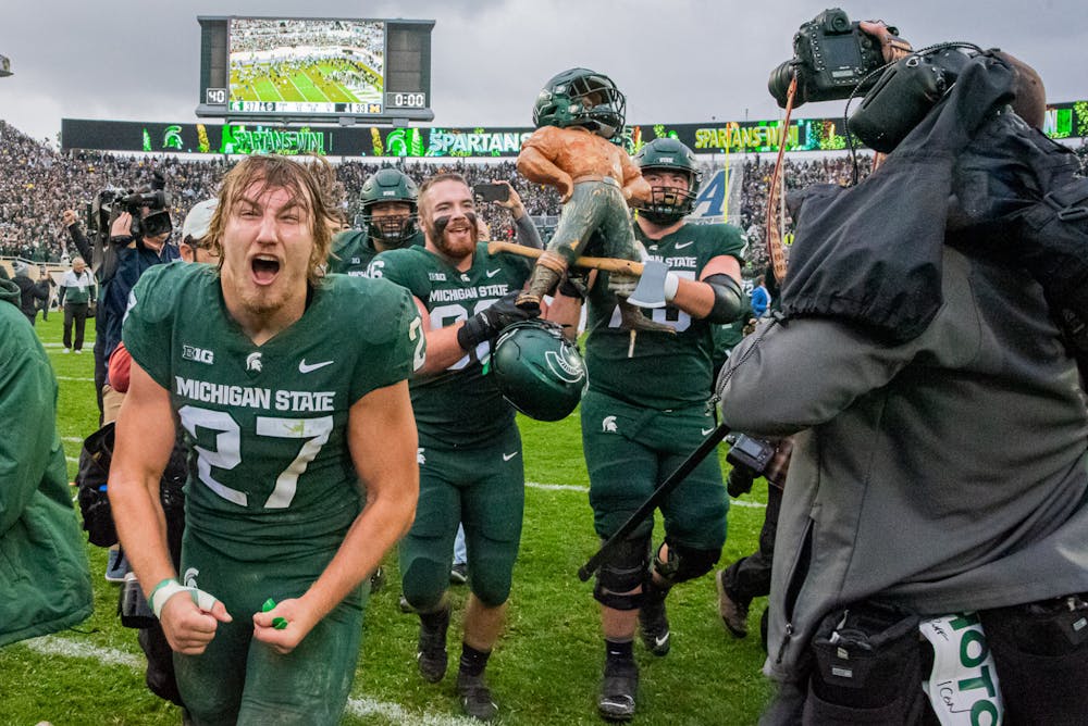 <p>Redshirt freshman linebacker Cal Haladay runs down the field after the Spartans raced back from a 16-point deficit to beat the Wolverines on Oct. 30, 2021.</p>