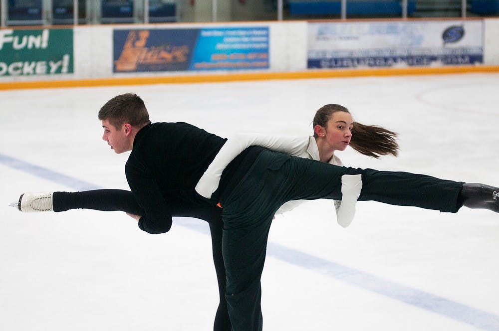 	<p>Haslett, Mich. resident Sam Parks, 14, and East Lansing resident Devin Pascoe, right, 15, skate Jan. 22, 2014, at Suburban Ice East Lansing, 2810 Hannah Blvd. The pair team has been skating together for over four years, and often competes at various competitions. Danyelle Morrow/The State News</p>