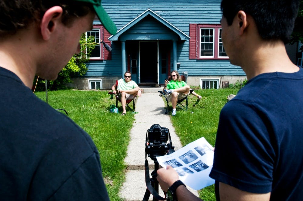	<p>English senior Cameron Laventure, far left, and media arts and technology senior Nathan Nie, far right, set up the first shot as actors political science senior Zack Sztanyo, left, and theatre senior Adam Ehrlich, right, sit in for reference Tuesday afternoon on the set of &#8220;Apocalypse Theory&#8221;. Laventure and his brother Brandon have been working on the script for the film, which is the duos first full length feature, for the last three years and began filming Tuesday.</p>