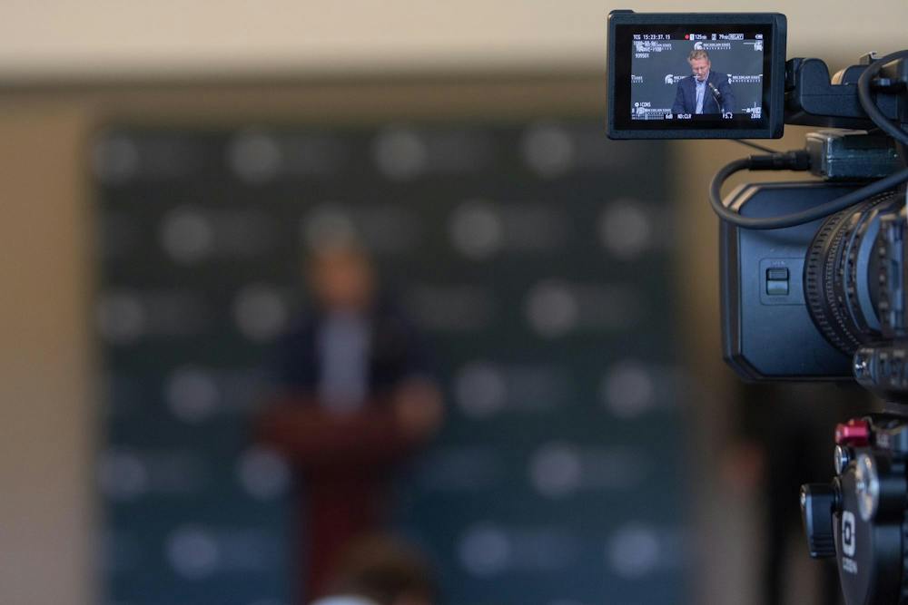<p>News cameras record Michigan State President Kevin Guskiewicz during the news conference for the widespread campus power outages at the Henry Center for Executive Development in East Lansing, Mich., on Monday, September 21, 2026.</p>