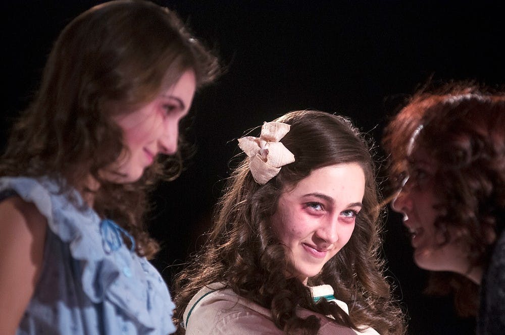 	<p>Theatre freshman Megan Cochrane watches fellow cast members interact during a performance of &#8220;Off With Her Head,&#8221; on Nov. 10, 2013, at the Auditorium. The performance was the seventh-annual freshman showcase put on by the Department of Theatre. Danyelle Morrow/The State News</p>