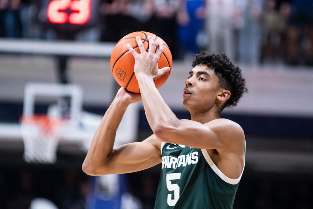 <p>Freshman guard Max Christie (5) shoots the ball during the game against Butler on Nov. 17, 2021, at the Hinkler Fieldhouse. The Spartans defeated the Bulldogs 73-52. </p>