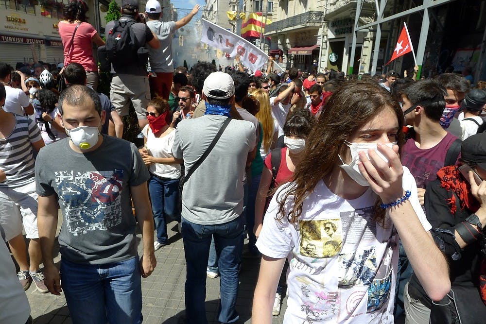 	<p>Protesters cover their faces after police fire another round of teargas towards the crowd in downtown Istanbul, Turkey, Saturday, June 1, 2013. (Roy Gutman/MCT)</p>