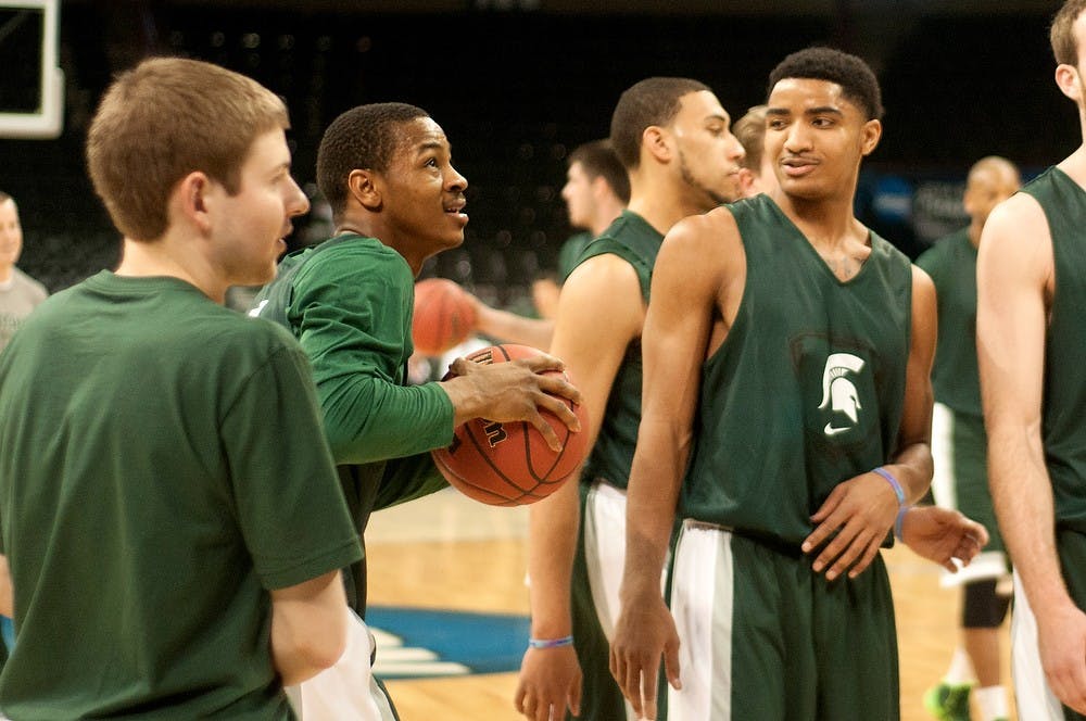<p>Sophomore guard Gary Harris talks to senior guard Keith Appling during a practice on March 19, 2014, at Spokane Veterans Memorial Arena in Spokane, Wash. The Spartans play their first game in the NCAA Tournament tomorrow. Betsy Agosta/The State News</p>