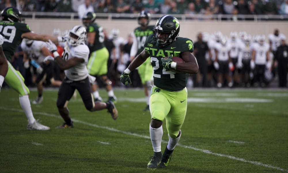 <p>Redshirt freshman Elijah Collins (24) runs the ball down the field in their game against the Broncos at Spartan Stadium on Sept. 7, 2019.</p>