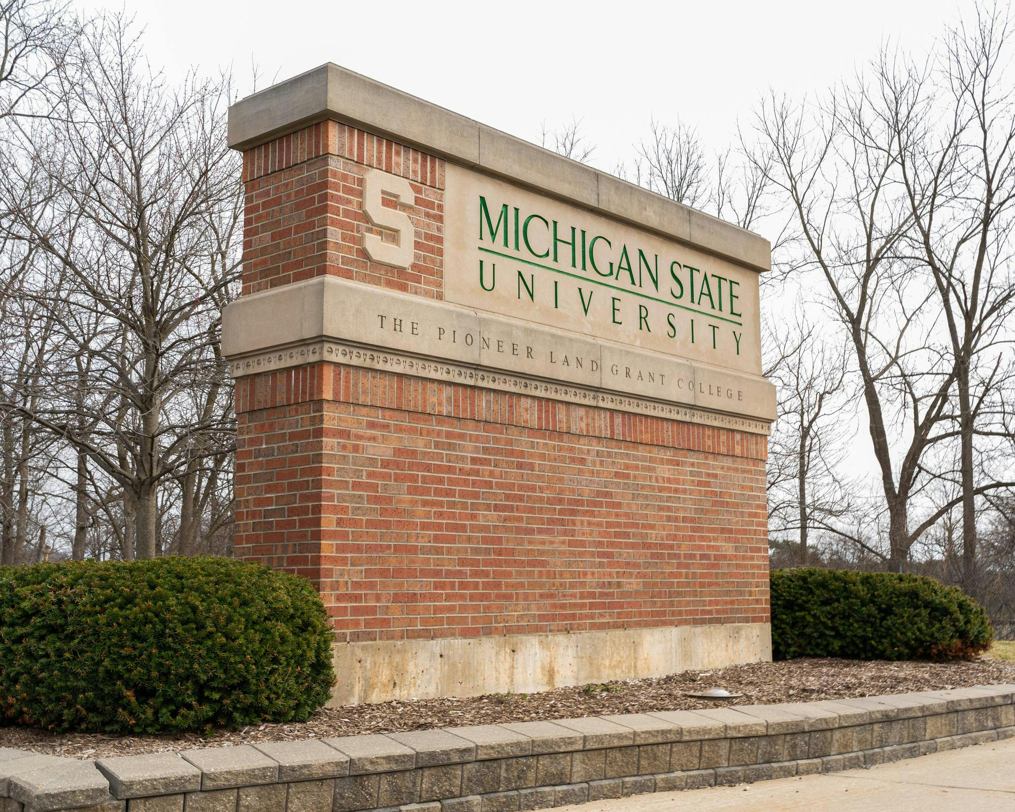 <p>The Michigan State University The Pioneer of the Land Grant College sign on the corner of Trowbridge Road and South Harrison Road. in East Lansing, Mich., on March 10, 2026.</p>