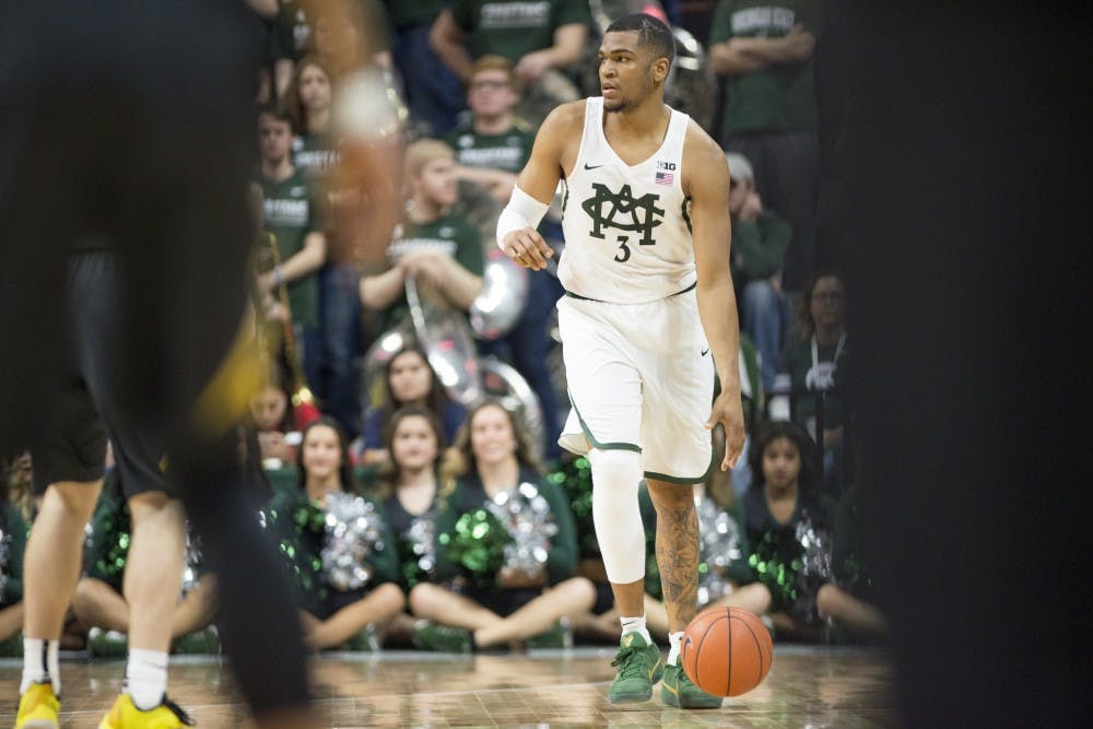 Senior guard Alvin Ellis III (3) dribbles the ball down the court during the second half of men's basketball game against Iowa on Feb. 11, 2017 at Breslin Center. The Spartans defeated the Hawkeyes, 77-66.