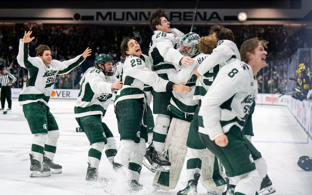 <p>The Spartans celebrate the game winning goal from freshman defenseman Patrick Geary (2) during a game against University of Michigan at Munn Ice Arena on March 23, 2024. MSU secured the Big Ten Tournament championship with their win over the Wolverines.</p>