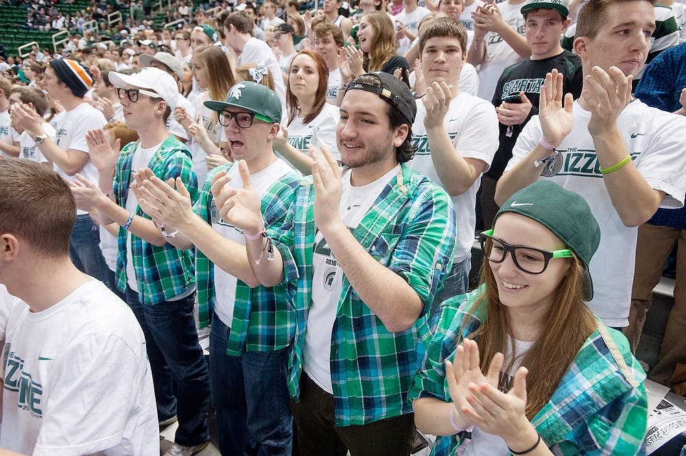 	<p>From left, kinesiology junior Stephen Zingg, psychology junior James Mooney, media information junior Brian Jenkins, and elementary education junior Mandy Morton cheer before the game against Nebraska, Sunday, Jan. 13, 2013, at Breslin Center. Justin Wan/The State News</p>