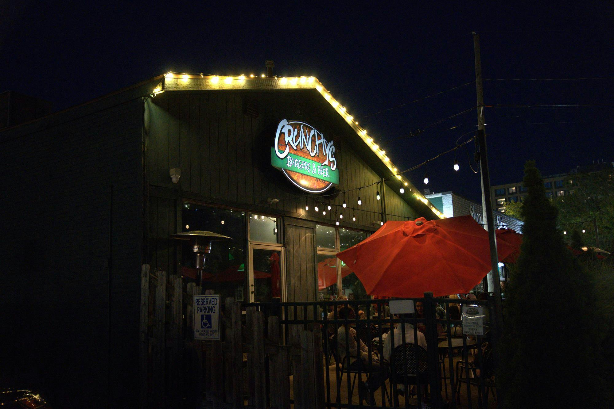 <p>Crunchy's Bar photographed at night</p>