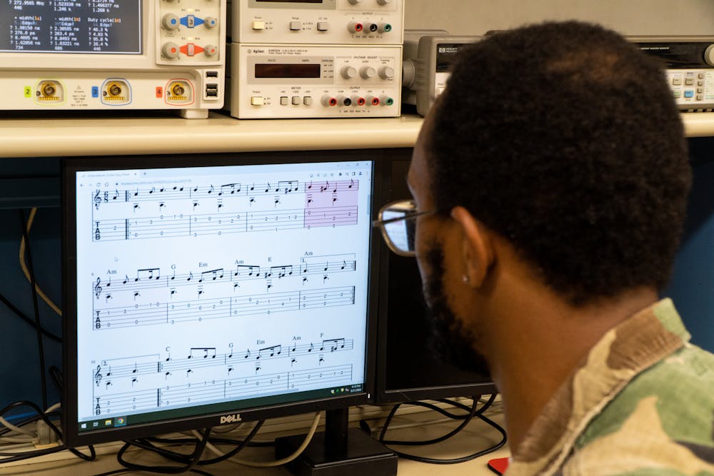 Computer engineering senior Timothy Boyd plays music on computers in a lab at Michigan State University's College of Engineering on Sept. 21, 2022. 