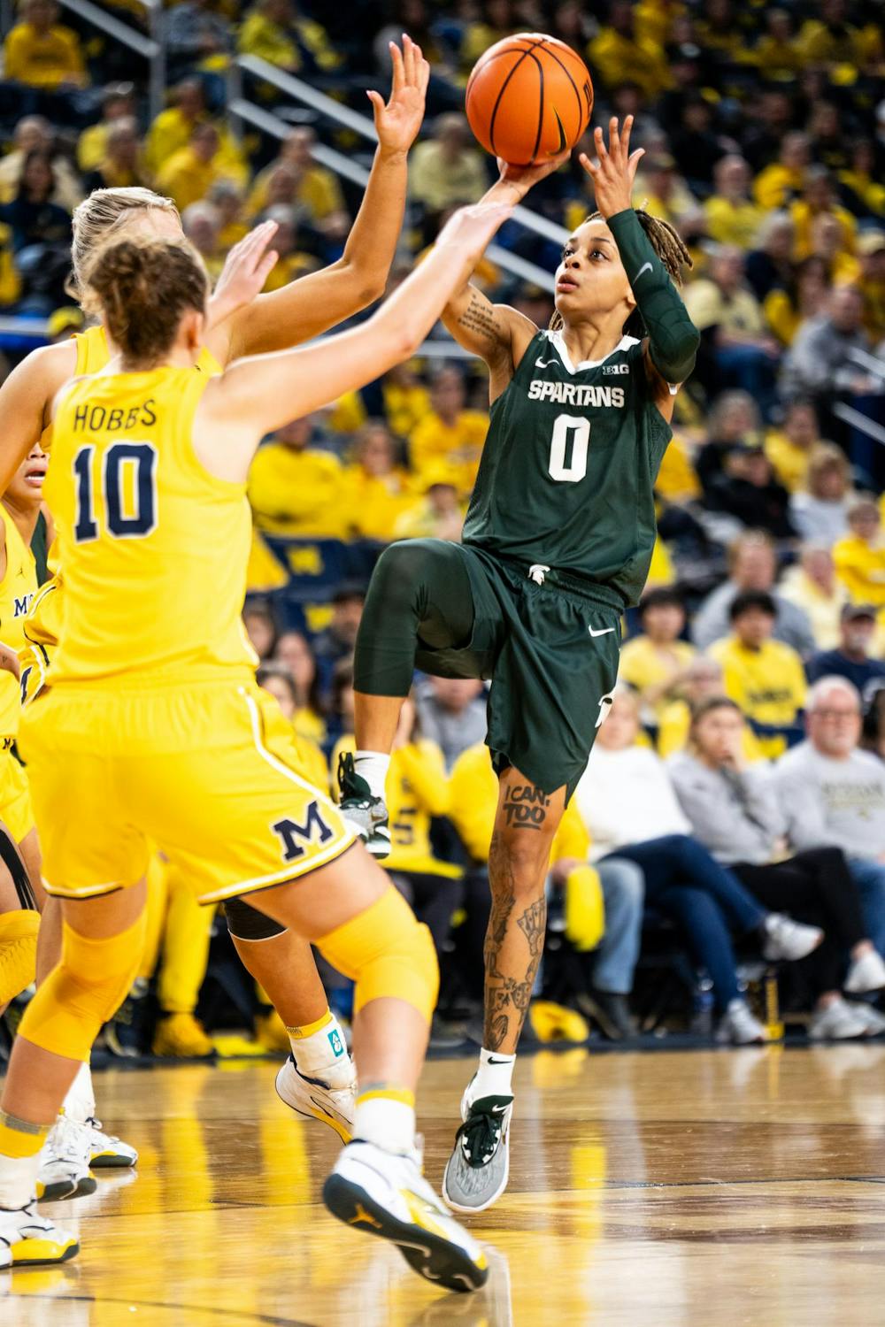 <p>Michigan State junior guard No. 0 DeeDee Hagemann shoots the ball at the Crisler center in Ann Arbor on Feb. 18, 2024. Michigan State secured a season sweep of the rival Wolverines, breaking a two-game losing streak in the process.</p>