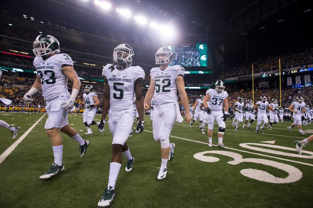 The Spartans take the field on Dec. 5, 2015 prior to the Big Ten championship game against Iowa at Lucas Oil Stadium in Indianapolis. The Spartans defeated the Hawkeyes, 16-13. 