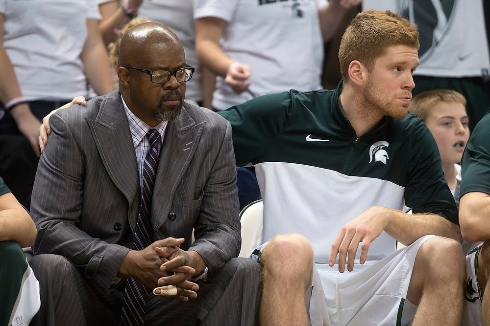 	<p>Junior guard Russell Byrd comforts assistant coach Mike Garland in the second half against Indiana on Jan. 21, 2014, at Breslin Center. The Spartans defeated the Hoosiers, 71-66. Julia Nagy/The State News</p>