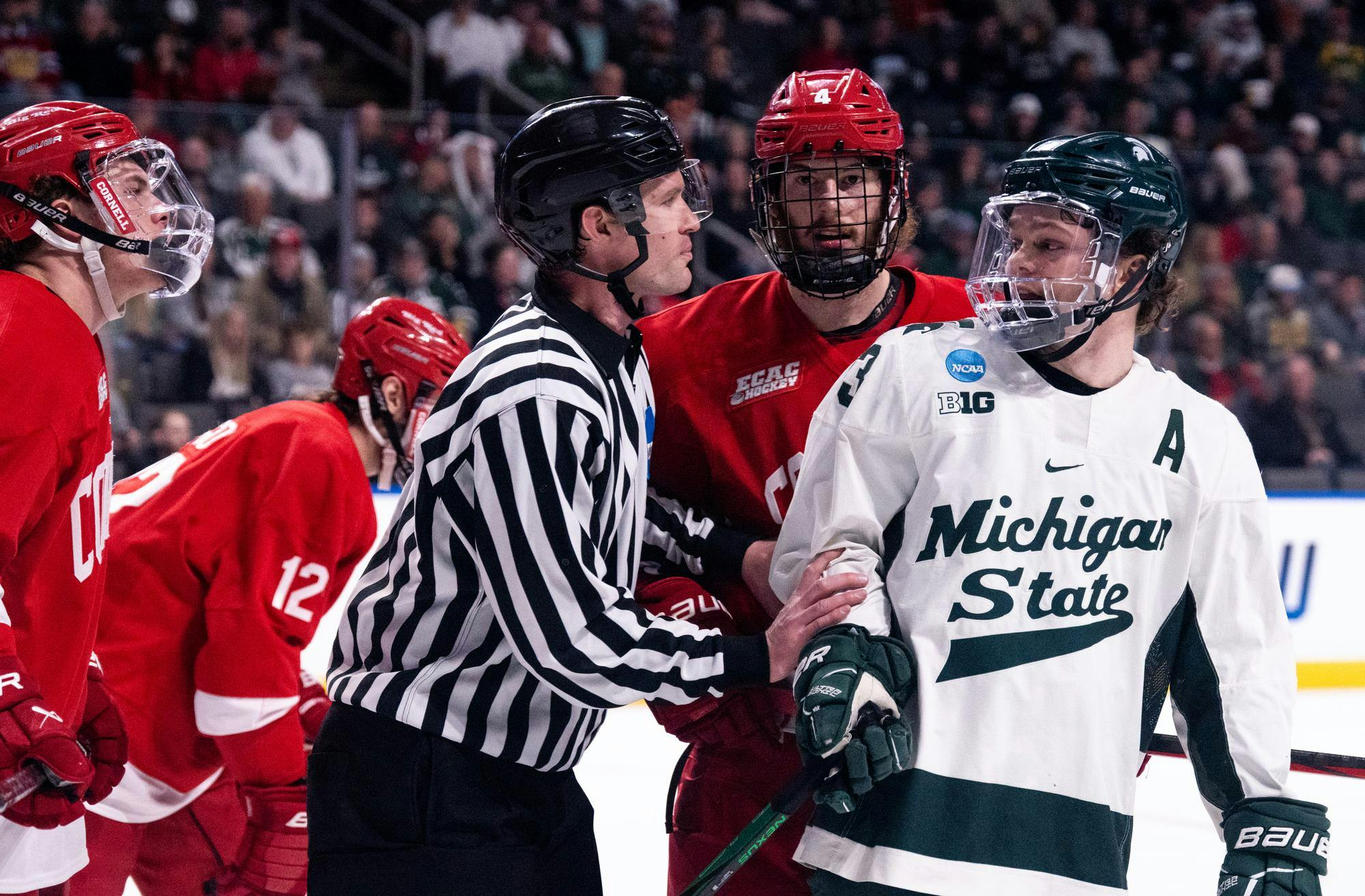 <p>Michigan State junior forward Tiernan Shoudy (13) is broken up from a scuffle at the Huntington Center on March 27, 2025. The Big Red defeated the Spartans, 4-3.</p>
