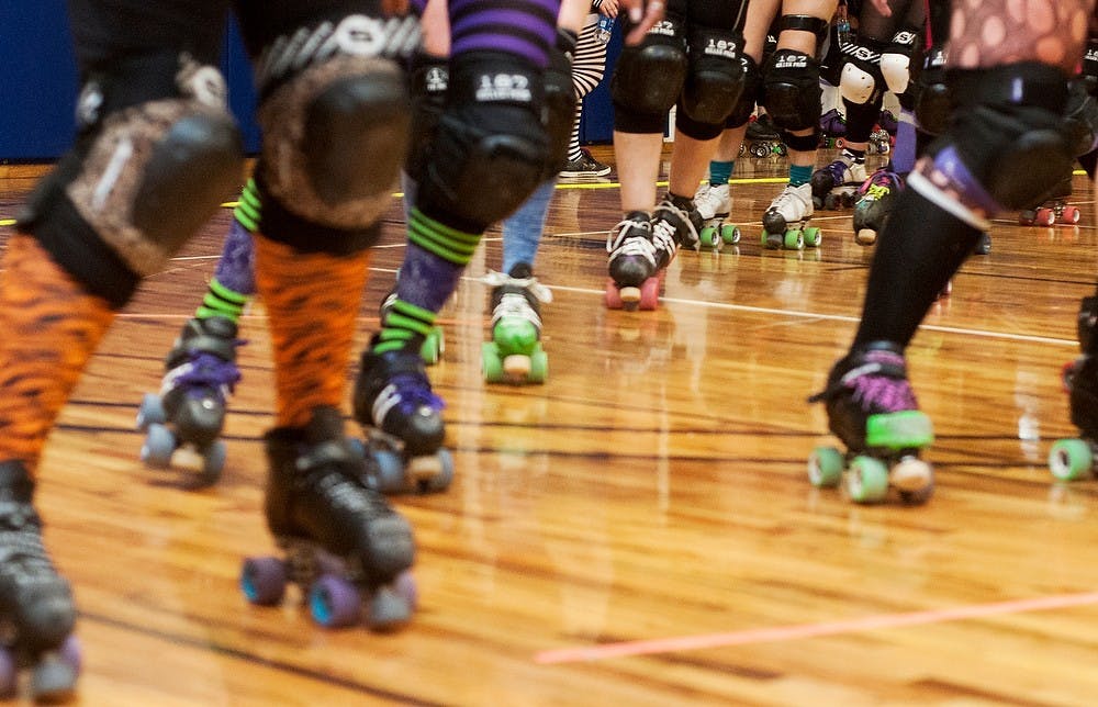 	<p>Members of the Lansing Mitten Mavens warmup before the roller derby bout on Nov. 9, 2013, at Court One Training Center. Bouts are held monthly and include a junior bout before the adults take the floor. Khoa Nguyen/The State News</p>
