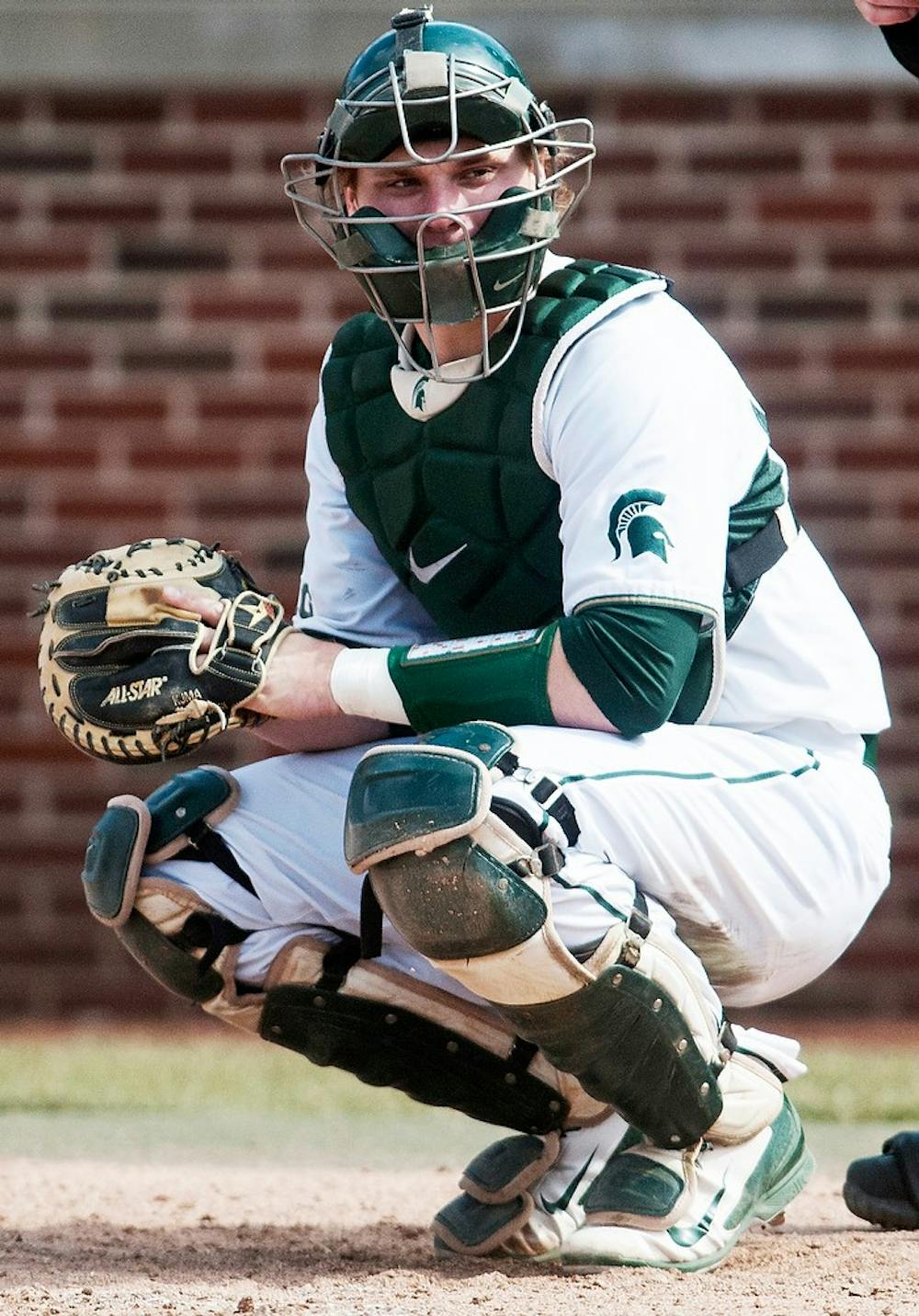 <p>Senior catcher Joel Fisher looks to the dugout during the game against Central Michigan on April 8, 2014, at McLane Baseball Stadium at Old College Field. The Spartans lost to the Chippewas, 10-1, ending MSU's 7-game winning streak. Danyelle Morrow/The State News</p>