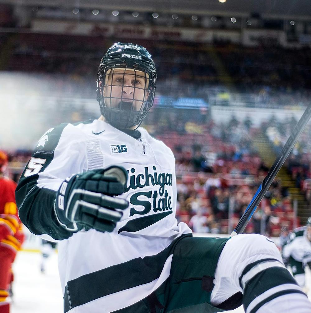 <p>Senior forward Brent Darnell celebrates his goal during the game against Ferris State on Dec. 28, 2014, during the 50th Great Lakes Invitational at Joe Louis Arena in Detroit. The Spartans defeated the Bulldogs, 2-0. Danyelle Morrow/The State News</p>