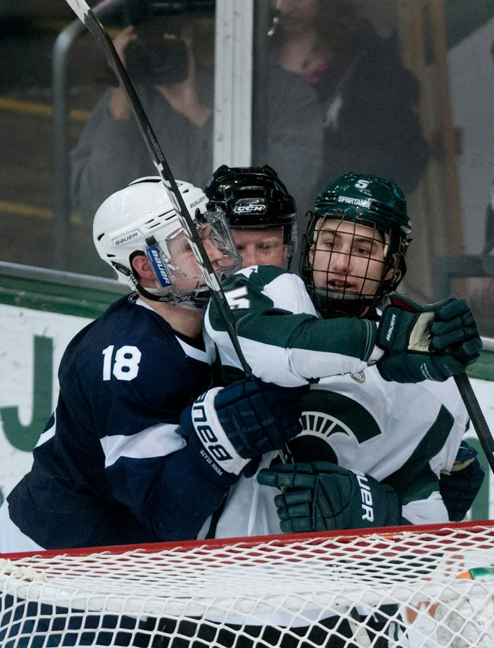 	<p>Penn State forward Casey Bailey and sophomore left defender R.J. Boyd are broken up by a referee  Jan. 25, 2013, at Munn Ice Arena. The final score was 5-3, with the Spartans taking the win. Katie Stiefel/The State News</p>