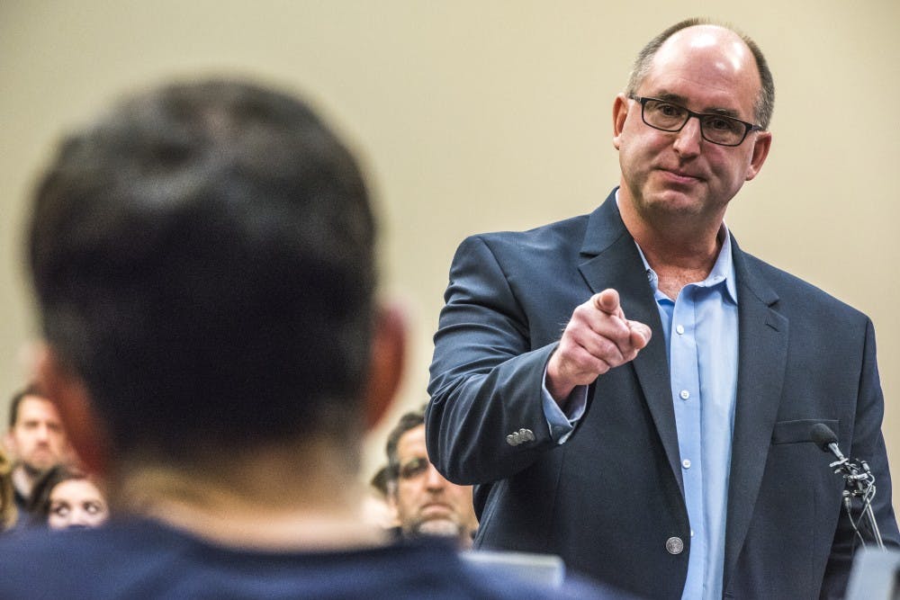 Brad Johnson, the father of Madeline Johnson and Kara Johnson, points at Ex-MSU and USA Gymnastics Dr. Larry Nassar as he gives a statement on the fourth day of Nassar's sentencing on Jan. 19, 2018, at the Ingham County Circuit Court in Lansing. (Nic Antaya | The State News)