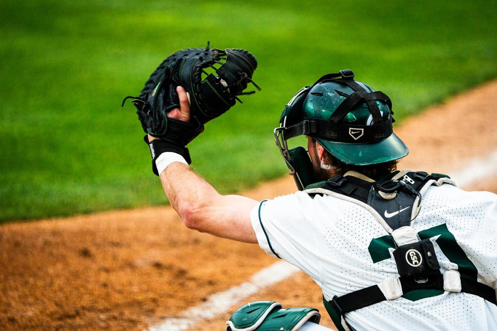 MSU graduate catcher Caleb Berry (31) catches a pitch during a game at McLane Stadium on April 13, 2025.
