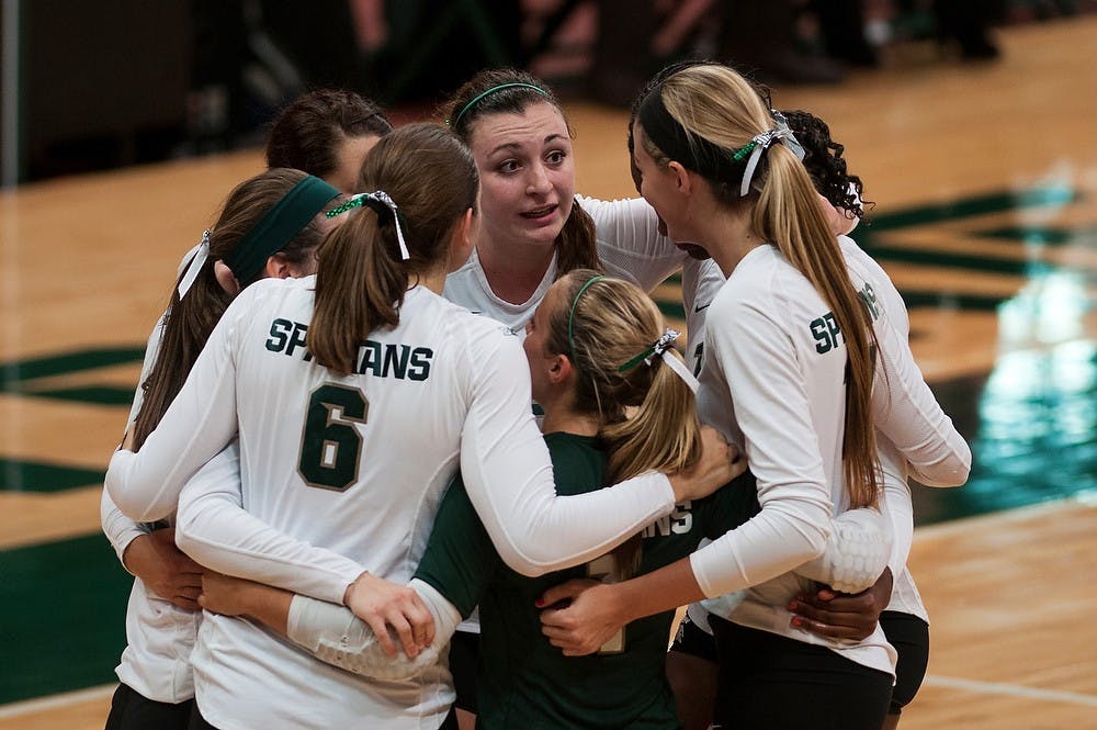 	<p>Senior outside hitter Lauren Wicinski gives the team a pep talk Oct. 26, 2013, at Jenison Field house. <span class="caps">MSU</span> lost to Indiana, 3-2. Margaux Forster/The State News</p>