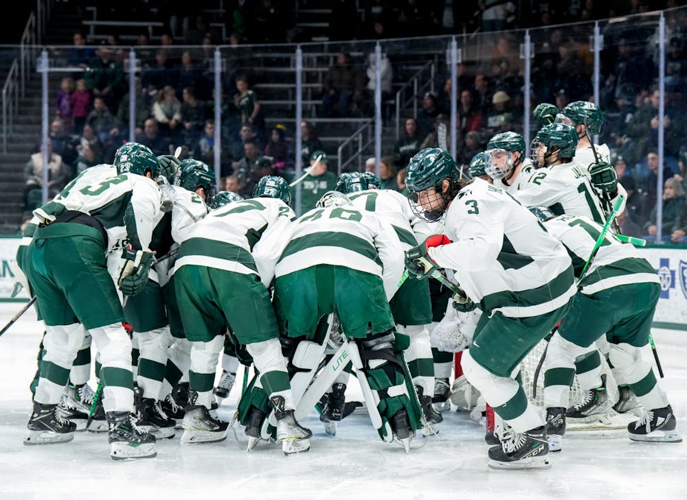 <p>The MSU men's hockey team huddles up before the game against Notre Dame at Munn Ice Arena on Feb. 3, 2023. The Spartans defeated the Fighting Irish 3-0.</p>