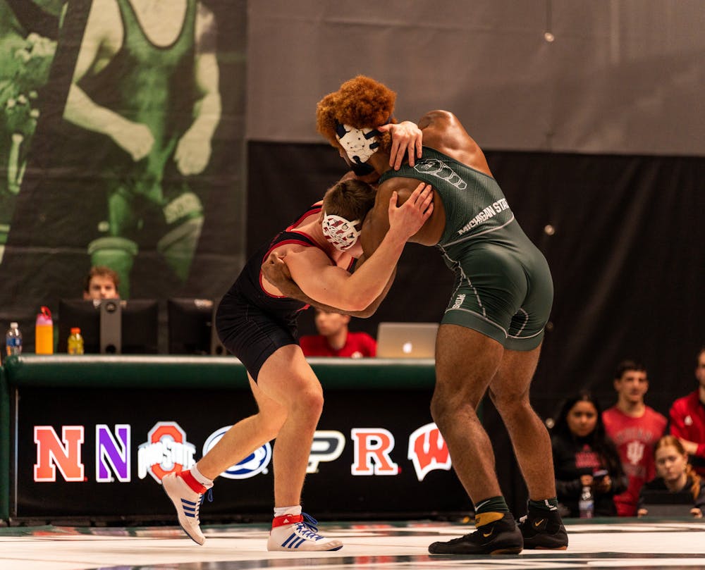 <p>Graduate student Cameron Caffey maneuvers for position against Indiana at Jenison Field House on Feb. 10, 2023.</p>