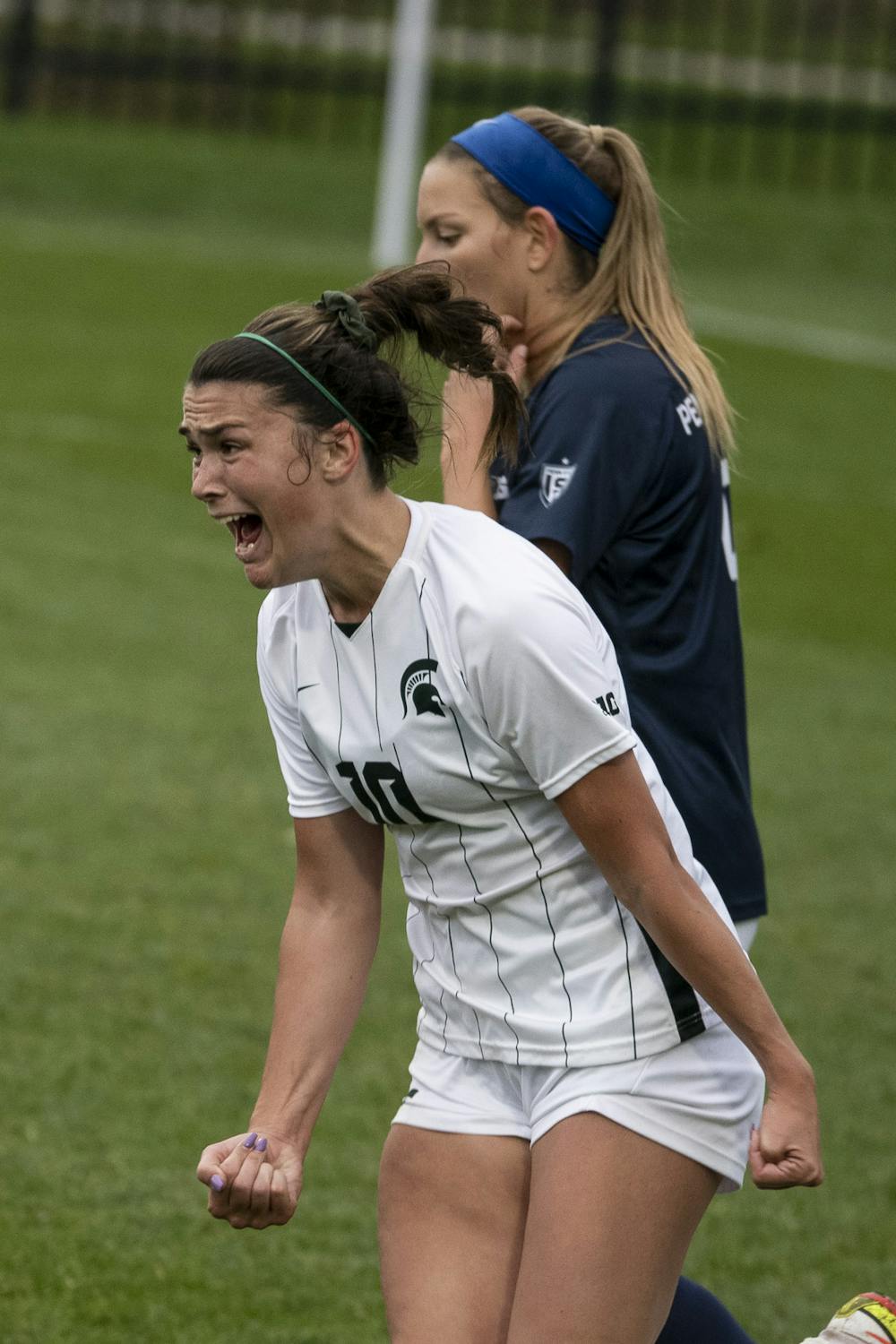 <p>Senior forward Camryn Evans (10) yells in excitement after scoring a goal during the game against Penn State on Oct. 24, 2021. The Spartans were defeated by the Nittany Lions 1-2.</p>
