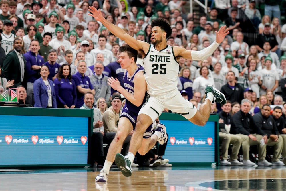 Graduate student forward Malik Hall (25)  loses the ball down the court during a match against Northwestern University at the Breslin Center on March 6, 2024. The Spartans defeated the Wildcats with a score of 53-49. 
