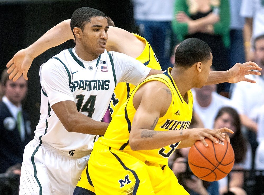 	<p>Freshman guard Gary Harris defends Michigan guard Trey Burke on Tuesday, Feb. 12, 2013, at Breslin Center. Justin Wan/The State News</p>