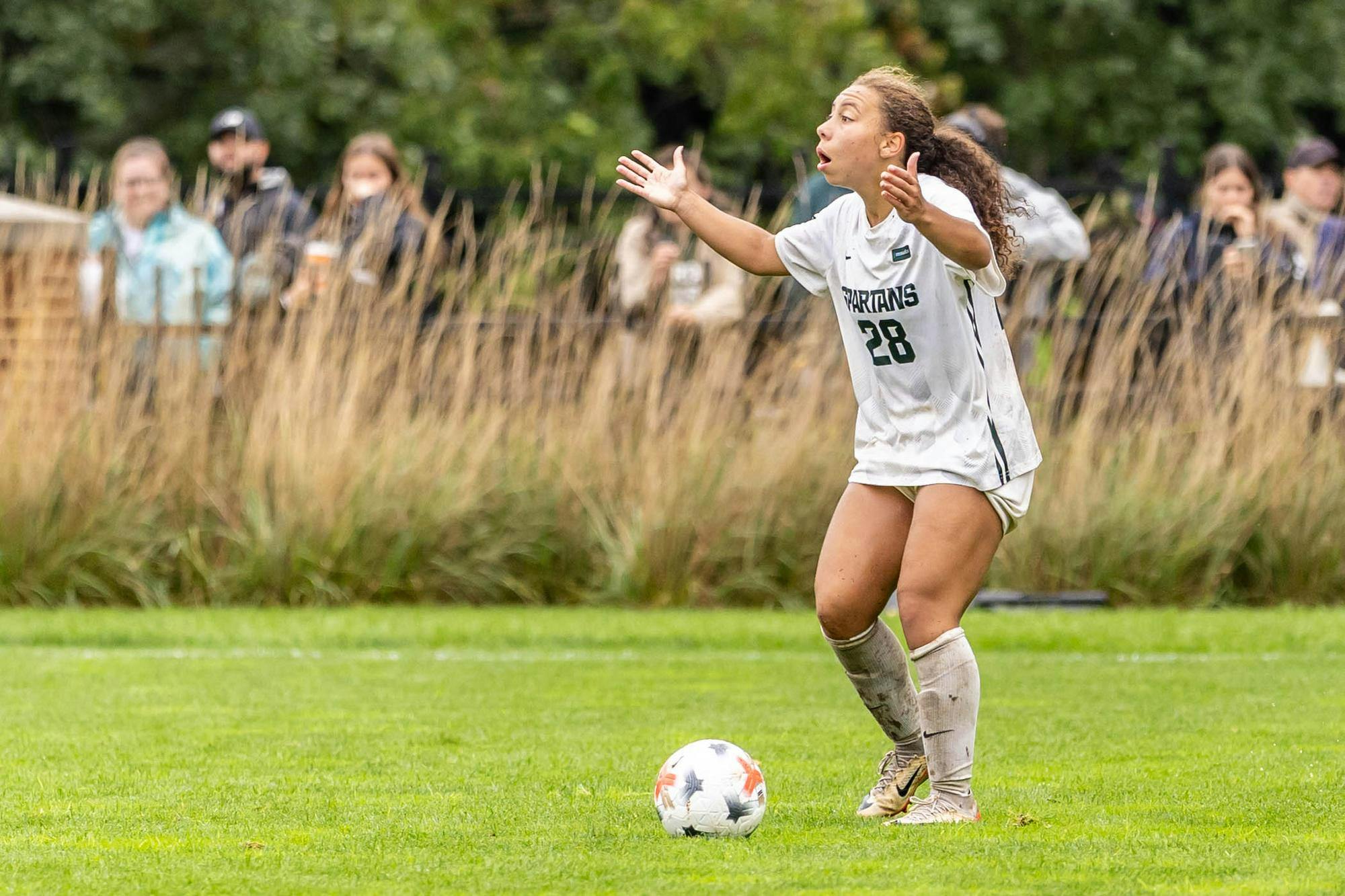 <p>MSU senior defender Renee Watson (28) stands shocked after a penalty call against the Spartans in the second half of their game against Michigan at DeMartin Stadium in East Lansing, Mich., on Sept. 20, 2026.</p>