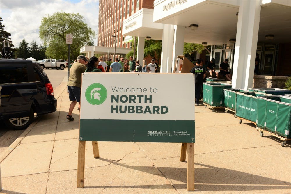 <p>Families of new and returning students pull up to North Hubbard Hall during Fall move in day on Aug. 25, 2019.</p>
