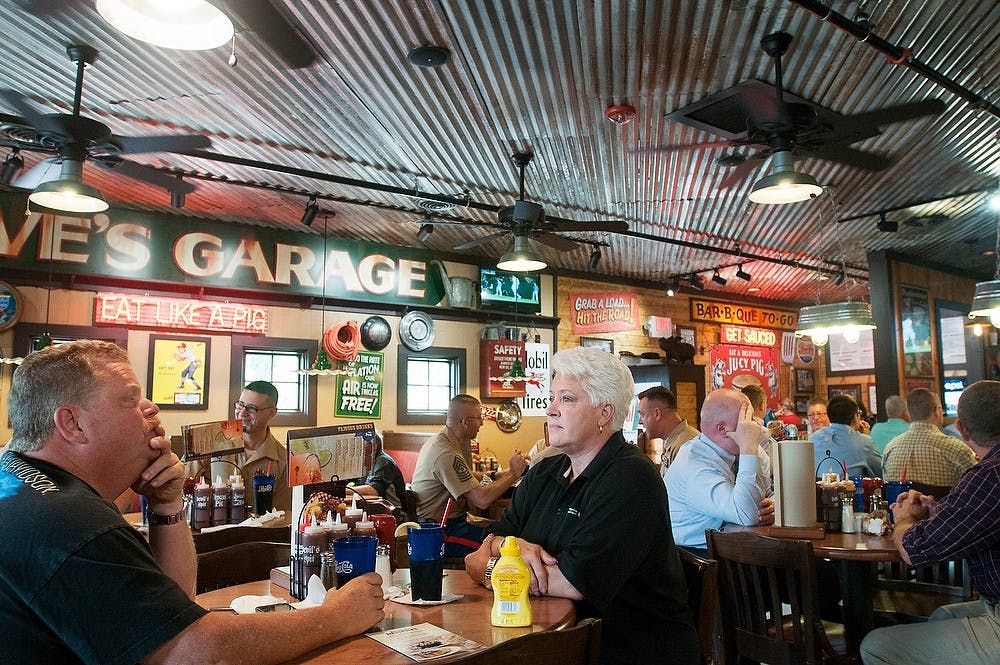 	<p>Diners eat at the new Famous Dave&#8217;s location, 2457 N. Cedar Road in Holt, Mich., on July 1, 2013. The restaurant was packed for lunch service. Julia Nagy/The State News</p>