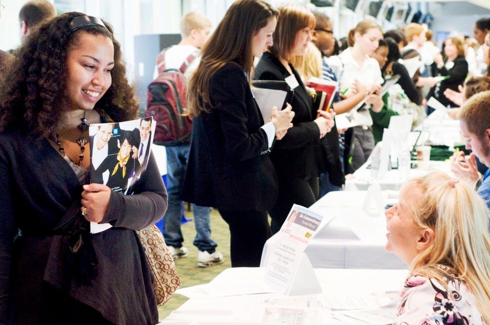 	<p>Political theory and constitutional democracy junior Keilee Ratajczak talks to a recruiter afternoon during the Earn, Learn and Intern Fair during fall 2011 at the Spartan Club in Spartan Stadium. <span class="caps">MSU</span> Career Services Network hosted the event and helped introduce students to internships and part-time jobs in Greater Lansing. </p>