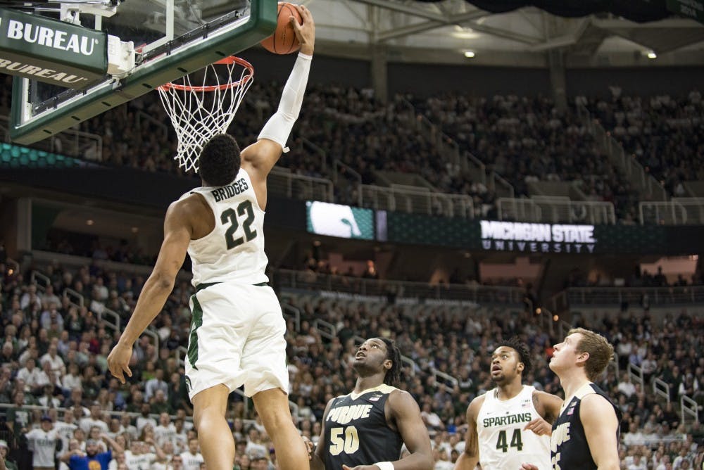 Freshman guard and forward Miles Bridges (22) goes for a dunk during the second half of the men's basketball game against Purdue on Jan. 24, 2017 at Breslin Center. The Spartans were defeated by the Boilermakers, 84-73.