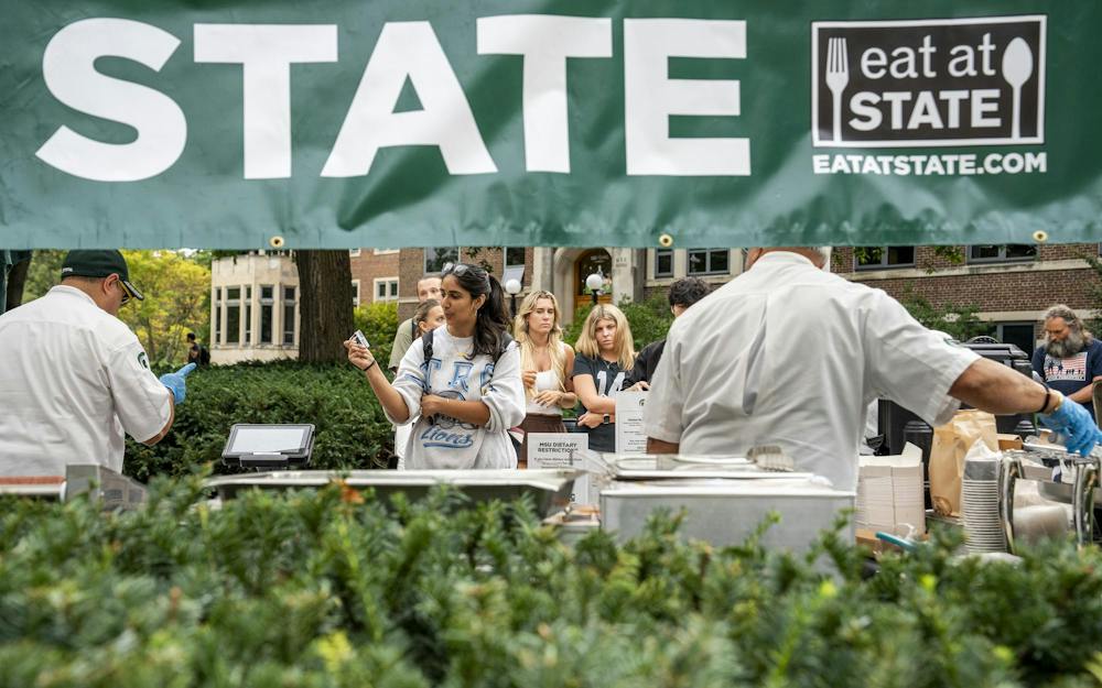 <p>Eat at State customers wait for their meal from the Culinary Services pop-up in the MSU Union courtyard in East Lansing, Mich., on Wednesday, Sept. 16, 2026.</p>