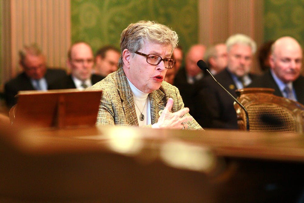 <p>MSU President Lou Anna K. Simon testifies Feb. 24, 2015, before a joint meeting of the state house and senate appropriations subcommittees on higher education at the Michigan state Capitol in downtown Lansing. Simon emphasized the ways MSU has cut costs after years of only slight funding increases.</p>