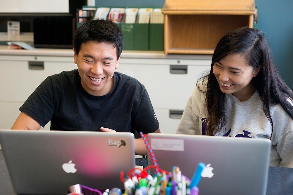 <p>Accounting sophomore Jiayun Sun receives help from psychology senior Rachel Huang while writing a personal statement for class Sept. 16, 2014, at the Writing Center at Bessey Hall. The center helps students strengthen their writing by providing one-on-one sessions. Julia Nagy/The State News</p>