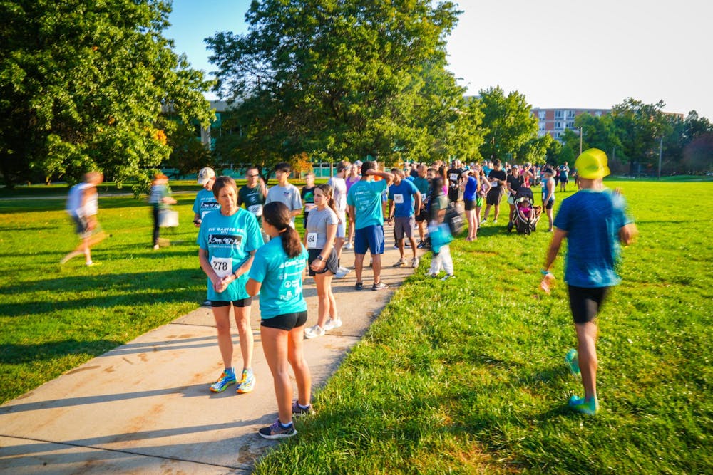 Participants gather behind the starting line during the Big Babies 5k Run at Conrad Hall on Sep. 15, 2024.