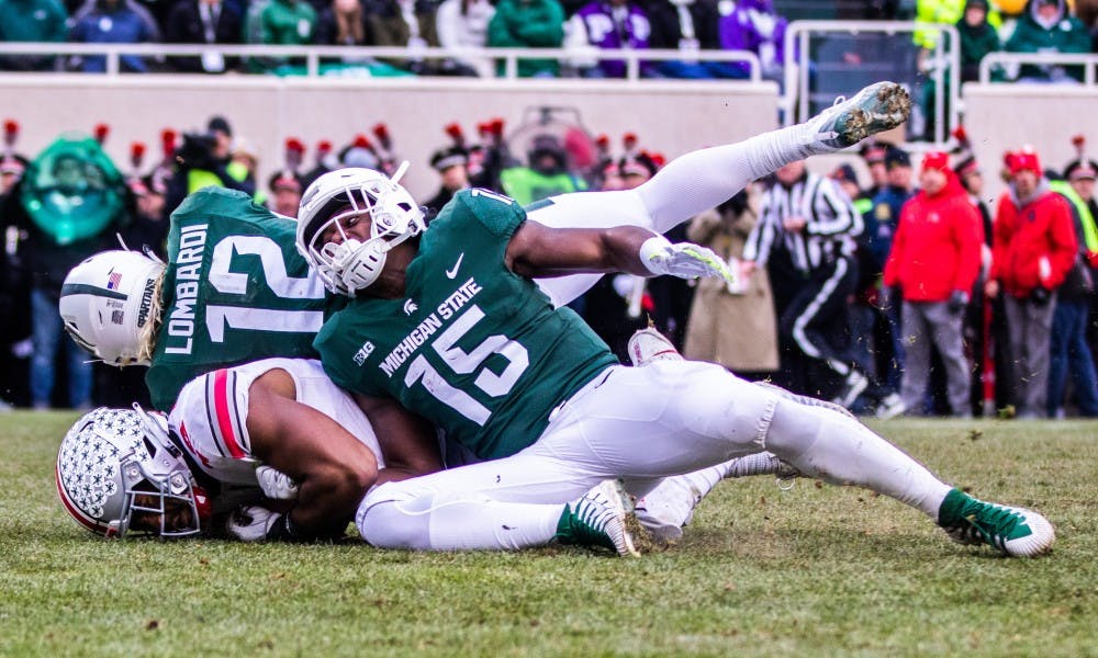 Redshirt freshman quarterback Rocky Lombardi (12) and freshman running back La'Darius Jefferson (15) during the game against Ohio State Nov. 10, 2018. The Spartans fell to the Buckeyes, 26-6.