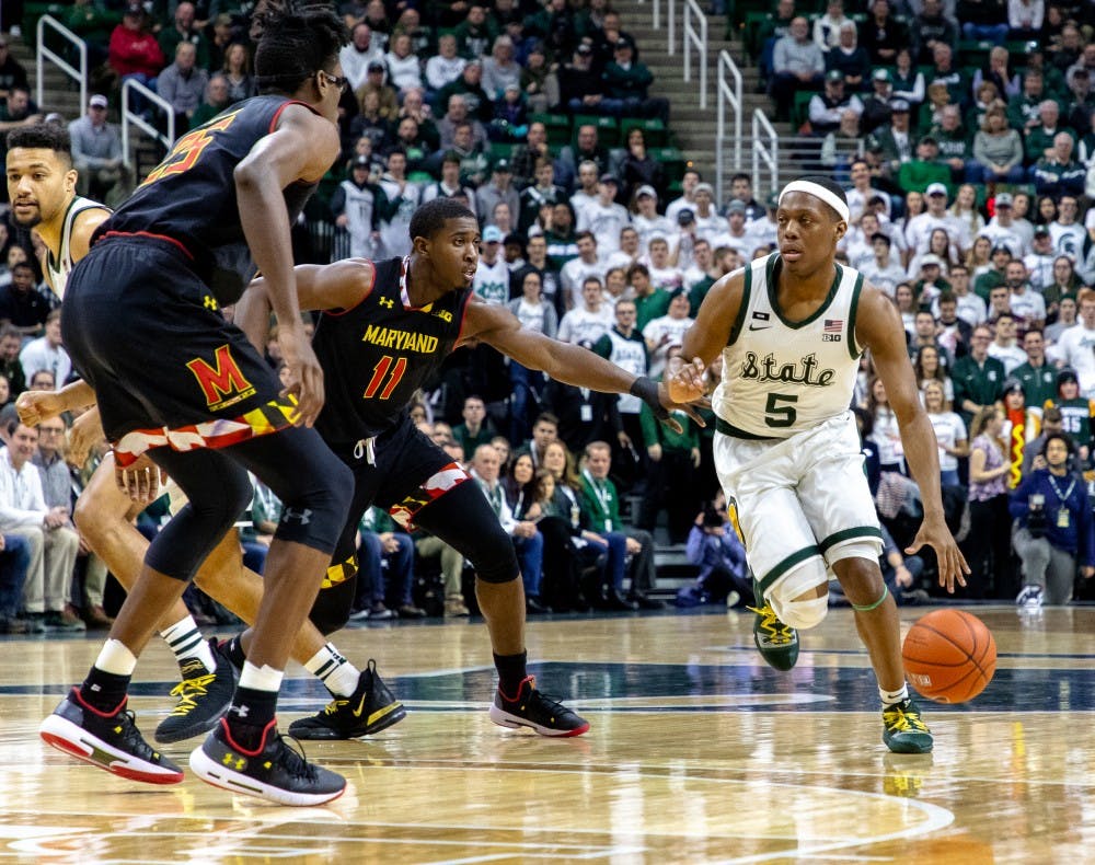 Junior guard Cassius Winston (5) dribbles past a defender during the game against Maryland on Jan. 21, 2019. The Spartans lead the Terrapins 31-20 at halftime.