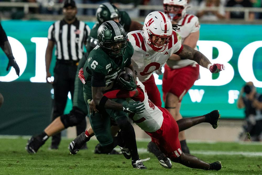 <p>Michigan State junior wide receiver Fredrick Moore (6) fights through Nebraska defenders during the Spartans’ game against Nebraska at Spartan Stadium in East Lansing, Mich., on Saturday, Sept. 26, 2026.</p>