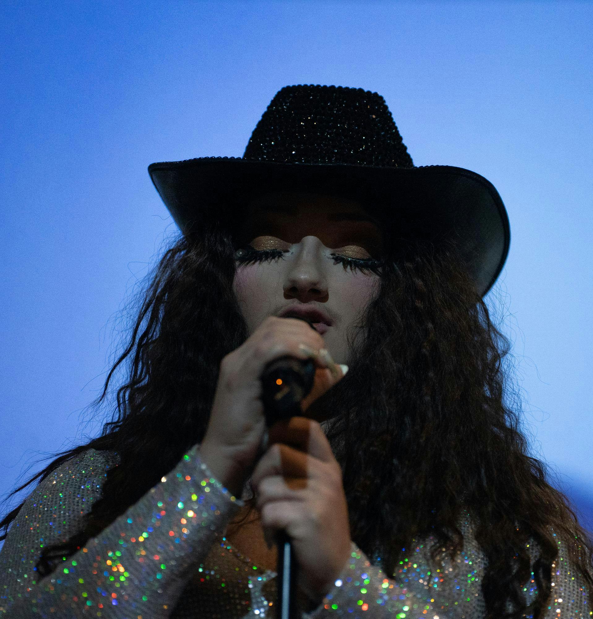 <p>Apparel and textile design junior Tristian Laney performs "Pink Pony Club" by Chappell Roan as Breakfast Booffet at FEMfest in the MSU Union Ballroom on Aug. 29, 2024. FEMfest is a celebration of feminism that encourages self-expression through several types of performance.</p>