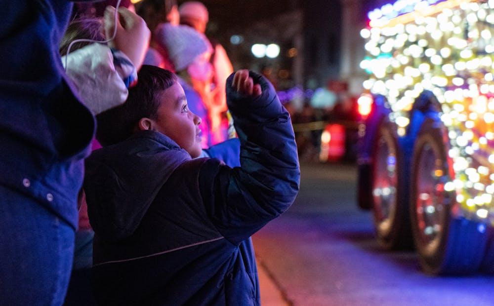 <p>Before the lighting, families enjoyed the electric light parade at Silver Bells, Lansing’s tree lighting ceremony and kickoff for the winter holidays. Photo taken on Nov. 19, 2021.</p>