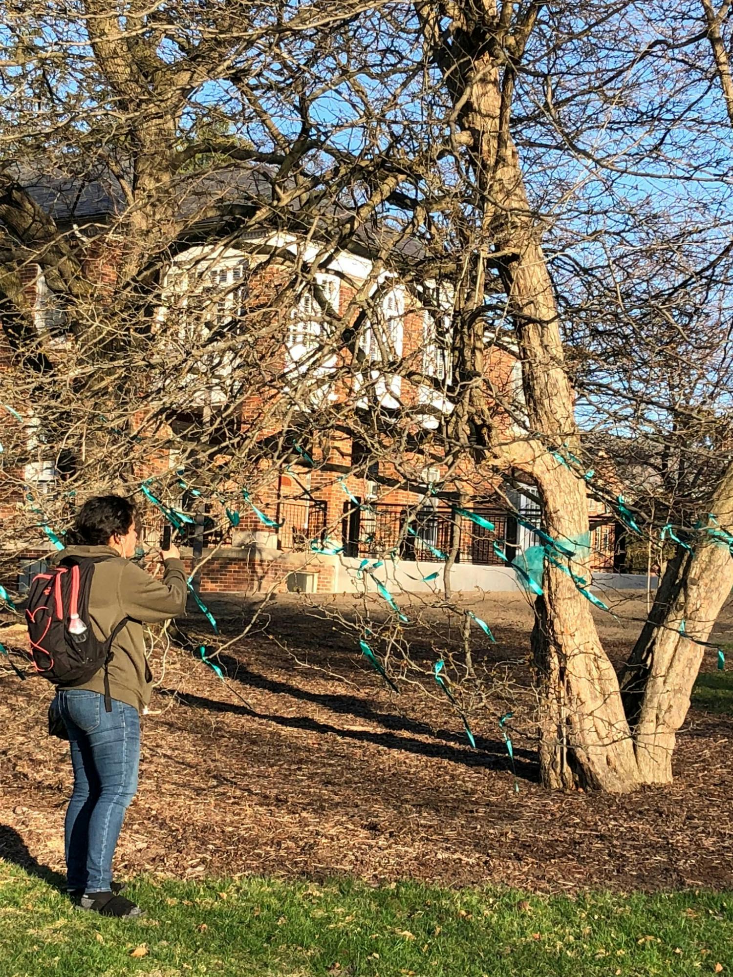 POSSE hung up teal ribbons outside of Former President Lou Anna K. Simon's office in April 2018 with a name of each survivor on a ribbon.